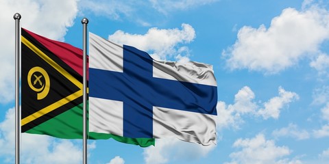 Vanuatu and Finland flag waving in the wind against white cloudy blue sky together. Diplomacy...