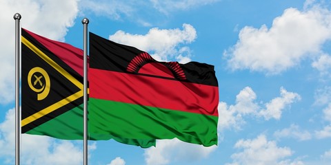 Vanuatu and Malawi flag waving in the wind against white cloudy blue sky together. Diplomacy...