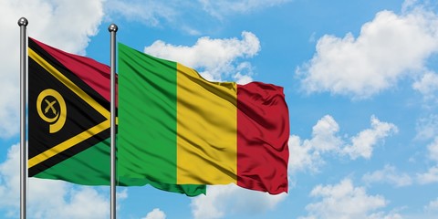 Vanuatu and Mali flag waving in the wind against white cloudy blue sky together. Diplomacy concept,...