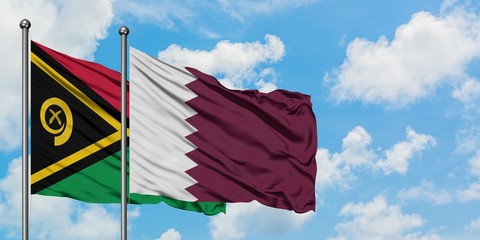 Vanuatu and Qatar flag waving in the wind against white cloudy blue sky together. Diplomacy...
