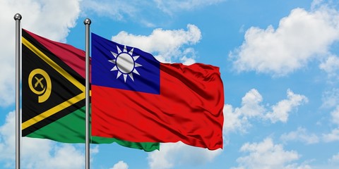 Vanuatu and Taiwan flag waving in the wind against white cloudy blue sky together. Diplomacy concept, international relations.