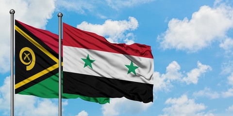 Vanuatu and Syria flag waving in the wind against white cloudy blue sky together. Diplomacy concept, international relations.