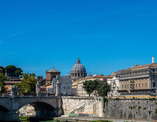 Fototapeta na wymiar View to Saint Peter basilica from Sant'Angelo bridge