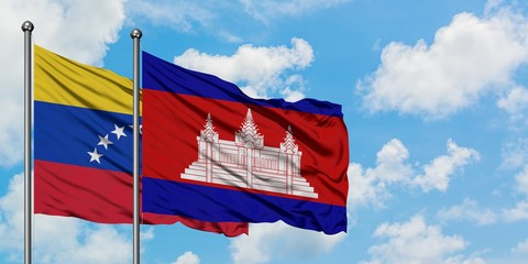 Venezuela and Cambodia flag waving in the wind against white cloudy blue sky together. Diplomacy concept, international relations.