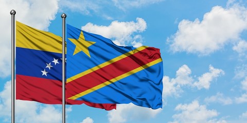 Venezuela and Congo flag waving in the wind against white cloudy blue sky together. Diplomacy concept, international relations.