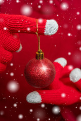 Christmas decoration - shiny red ball. Festive composition.
