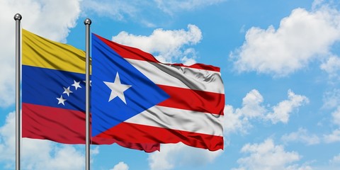 Venezuela and Puerto Rico flag waving in the wind against white cloudy blue sky together. Diplomacy concept, international relations.