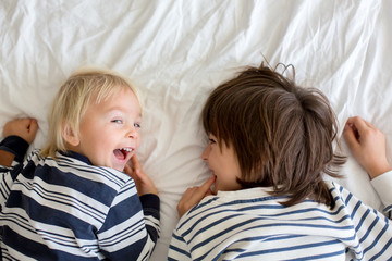 Brothers, playing at home, tickling feet laughing and smiling