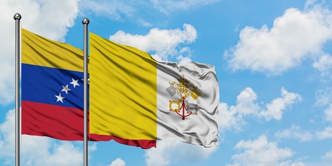Venezuela and Vatican City flag waving in the wind against white cloudy blue sky together. Diplomacy concept, international relations.