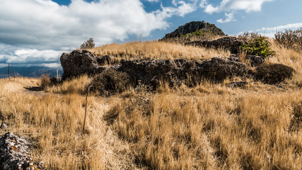 A path on a hill overgrown with dry grass