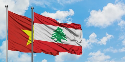 Vietnam and Lebanon flag waving in the wind against white cloudy blue sky together. Diplomacy concept, international relations.