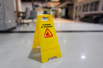 Cleaning in progress sign on the floor.