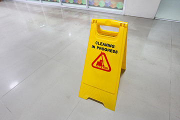 Cleaning in progress sign on the floor.