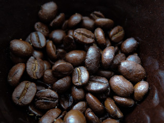 Brown coffee beans, close-up of coffee beans for background and texture