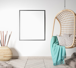 Interior mock-up frame in white background, home design with rattan swing and black frame in...