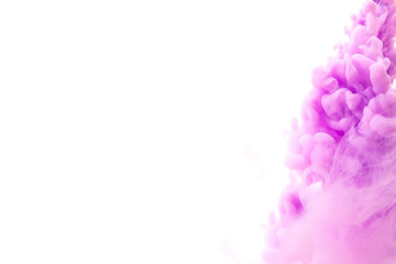 Abstract flowing liquid or purple ink in water on a white background.