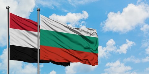 Yemen and Bulgaria flag waving in the wind against white cloudy blue sky together. Diplomacy concept, international relations.