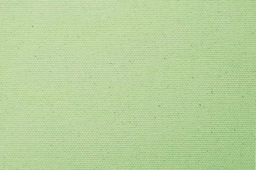 Hessian sackcloth woven texture pattern background in pale green lime yellow earth tone color