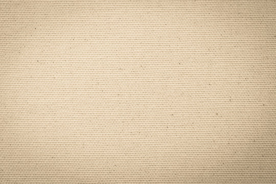 Fototapeta Hessian sackcloth woven texture pattern background in light yellow cream brown