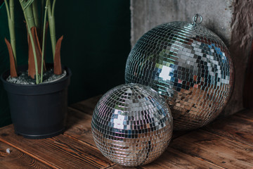 Shiny glass disco balls on black background