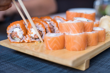 Philadelphia Sushi Roll - Maki Sushi with Philadelphia Cheese inside. Salmon and Tuna outside.