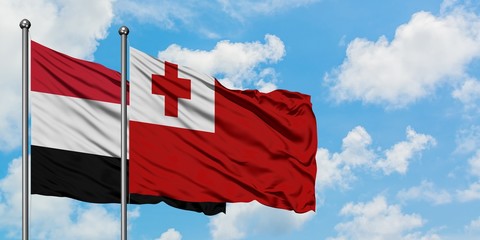 Yemen and Tonga flag waving in the wind against white cloudy blue sky together. Diplomacy concept, international relations.