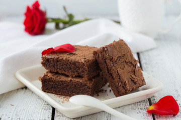 White isolated background with clipping paths homemade dark chocolate brownies and mint delicious...