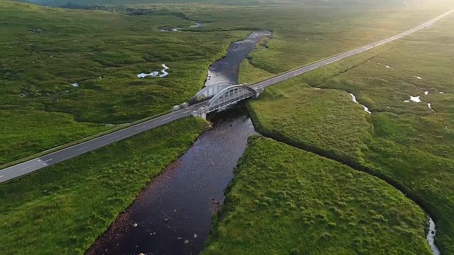 The only road in the glencoe valley filmed from the drone. A long river passes underneath the bridge.This scenic place has been used as a location in several films.