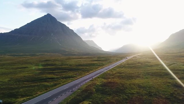 The incredible glencoe valley seen from the drone. This is the only road in this ancient volcanic area and it is surrounded by great mountains.