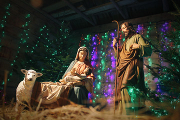 Christmas Manger scene with figures including Jesus, Mary, Joseph, sheep and magi. Christmas...