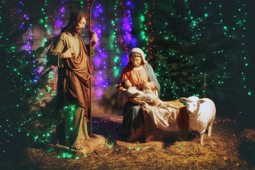 Christmas Manger scene with figures including Jesus, Mary, Joseph, sheep and magi. Christmas...