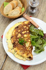 herbed omelette and bacon on a plate