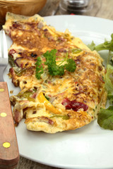 omelette with peppers and bacon on a plate