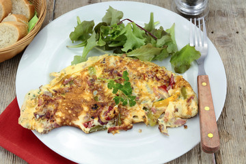 omelette with peppers and bacon on a plate