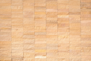 Rock tile wall texture background in natural cream brown beige