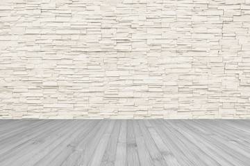 Stone tile wall limestone rock background in light beige color tone with grey wooden floor 