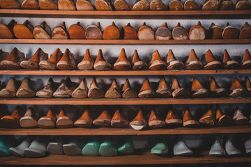 A collection of shoe models on shelves.