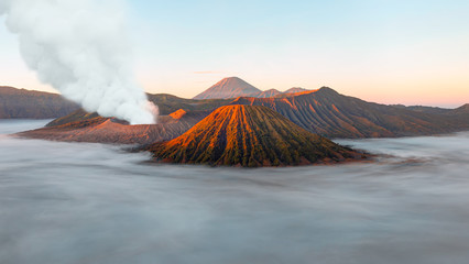 Beautiful landscape with Mount Bromo volcano viewpoint in Bromo Tengger Semeru National Park at sunrise, Indonesia.