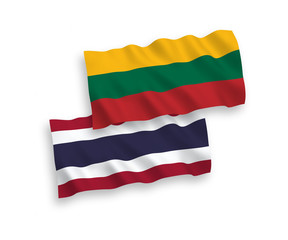 National vector fabric wave flags of Lithuania and Thailand isolated on white background. 1 to 2 proportion.