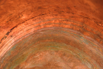 Copper surface of the inner part of the copper pot. Color oxidation of copper. Copy space.