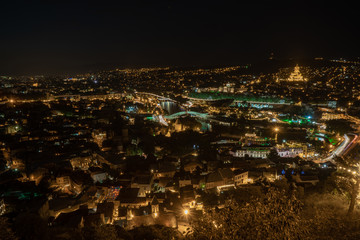 Night view of Tbilisi with Sameba (Trinity) Church and other landmarks. Beautiful Place to travel.