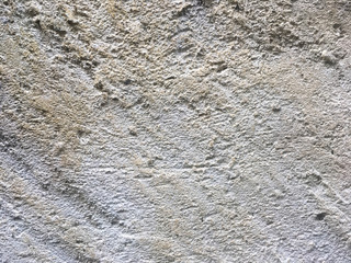 peeled stone wall background with structure facade, space for text, cement rough stone wall