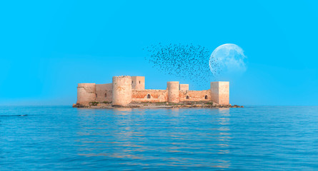 The maiden's castle (Kiz Kalesi) with full moon -  Mersin Turkey "Elements of this image furnished by NASA