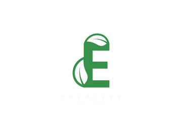 The combination of leaves and letters of the alphabet. Minimalist and simple design in green