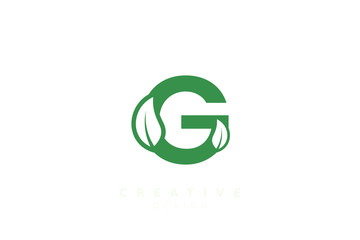 Obraz premium The combination of leaves and letters of the alphabet. Minimalist and simple design in green