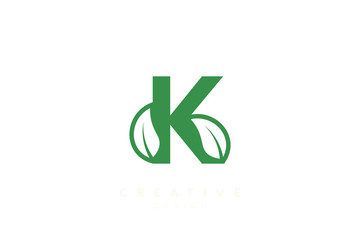 The combination of leaves and letters of the alphabet. Minimalist and simple design in green