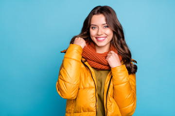 Closeup photo of amazing millennial lady easy-going person holding knitted scarf wear modern stylish autumn windbreaker isolated blue color background
