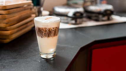 iced coffee put on black table in mini cafe