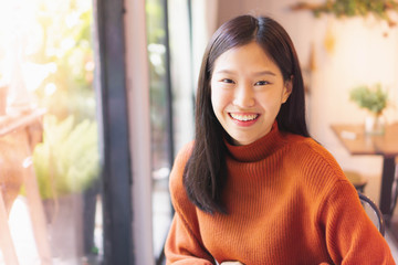 Asian beautiful woman smiling working with laptop  in cafe or restaurant 