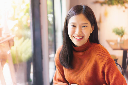Asian beautiful woman smiling working with laptop  in cafe or restaurant 